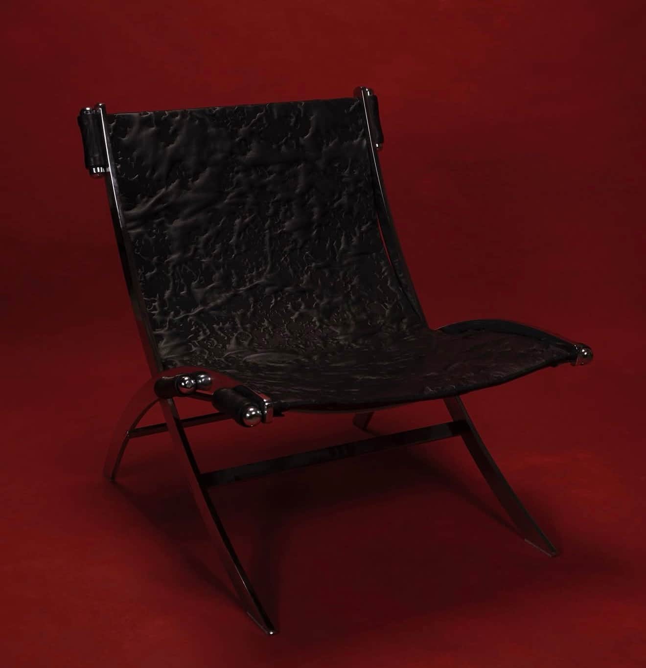 A modern lounge chair with a striking contemporary design. The chair features a polished chrome meta… — free OBJ 3D model