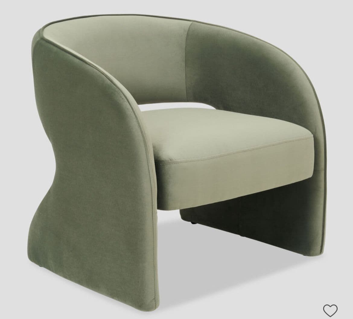 A modern armchair with a curved silhouette and upholstered in a soft fabric. The armchair features a rounded backrest that flows into flared armrests, and a separate seat cushion. The base structure is integrated into the sides, creating a sculptural form. — 3D model