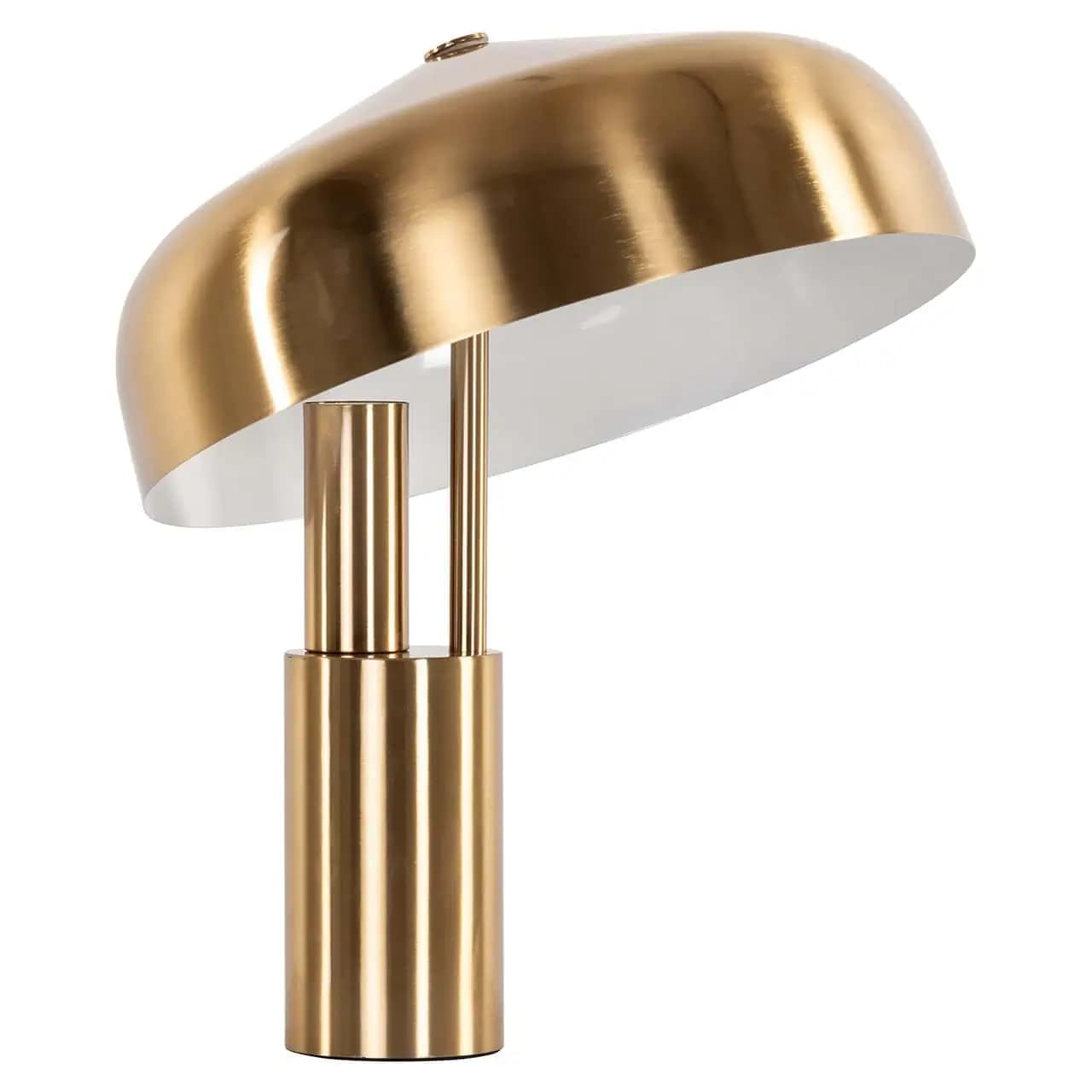 A modern table lamp featuring a polished brass finish. The lamp has a cylindrical base from which two slender vertical supports rise, holding a distinctive tilted mushroom-shaped or dome shade. The interior of the shade is white, contrasting with the exterior's reflective gold surface, designed to direct light downwards and outwards. — 3D model