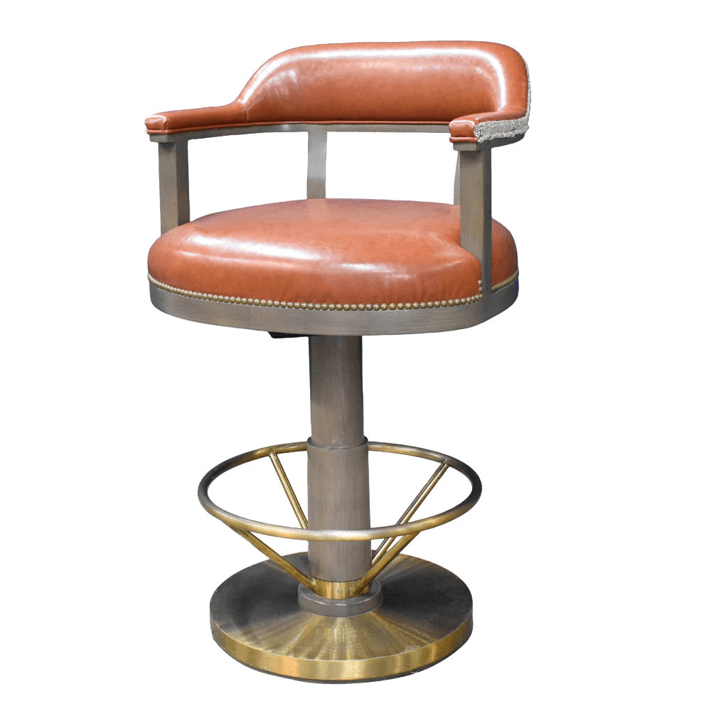 A swivel bar stool with a brown leather upholstered seat and backrest. The seat and back are trimmed with decorative metal studs. The stool features a central support column with a footrest ring and a wide, circular base. The armrests are integrated into the backrest structure and are also upholstered. — 3D model