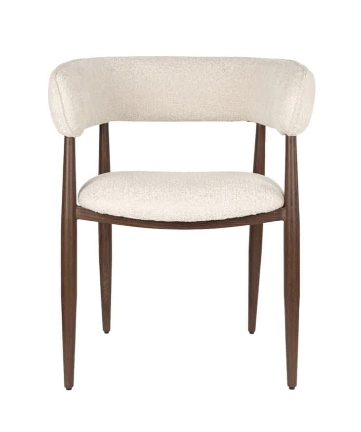 A contemporary dining chair featuring a dark wood frame and light cream-colored boucle upholstery. The chair has a wide, gently curved backrest that seamlessly integrates into short, supportive armrests. The seat is a padded, rounded rectangle. Four tapered, round wooden legs splay slightly outwards, providing stability and contributing to its sleek, minimalist aesthetic. — 3D model