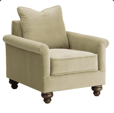 A comfortable, traditional style armchair with rolled arms, upholstered in a light beige fabric, featuring a loose seat cushion, a loose back pillow, and four dark turned wooden legs. — 3D model