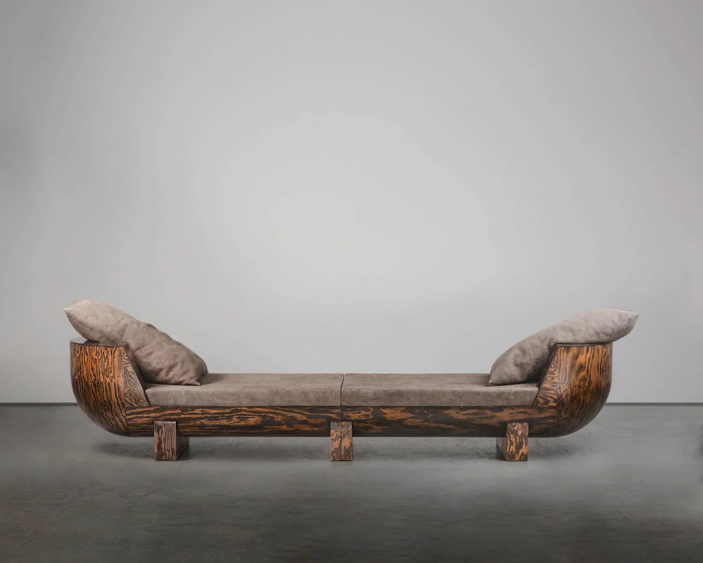 A contemporary two-seater sofa with a unique, curved wooden frame and upholstered seating. The frame… — free GLTF 3D model