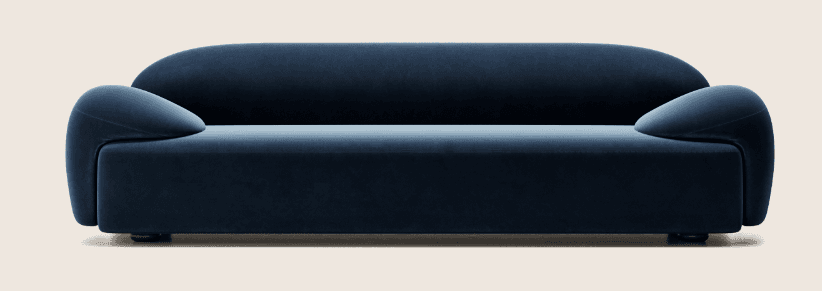 A deep blue, low-profile sofa with rounded arms and a continuous, flowing backrest. The sofa appears to be upholstered in a plush fabric, possibly velvet. It has a minimalist design with a visible base or legs that are dark and subtle. The overall shape is modern and organic, eschewing sharp angles. — 3D model