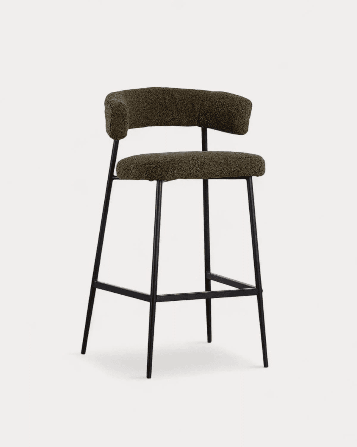 A modern bar stool with a curved backrest and seat, upholstered in a textured, olive-green fabric. The frame is constructed from slender, dark metal legs that extend upwards to support the seat and backrest. A horizontal stretcher bar connects the front and rear legs for added stability. — 3D model